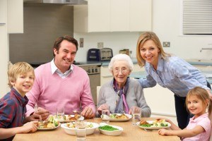 Multi-generation family sharing meal together